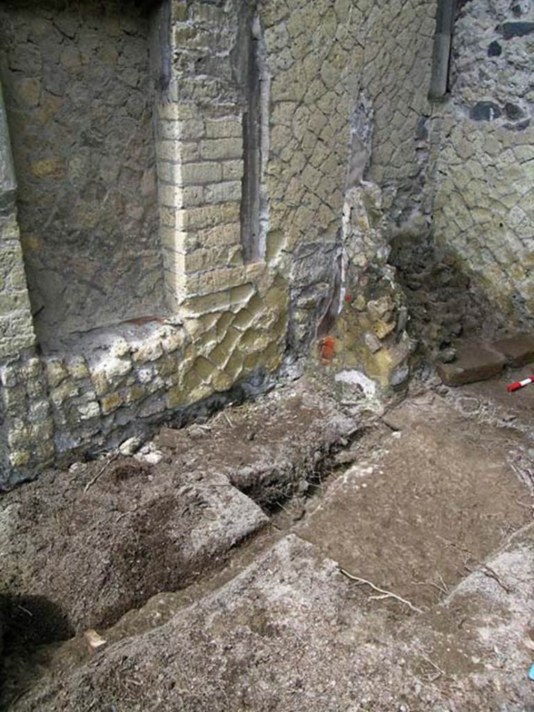 V.34, Herculaneum. May 2004. Looking towards excavation near west wall of shop.
Photo courtesy of Nicolas Monteix.